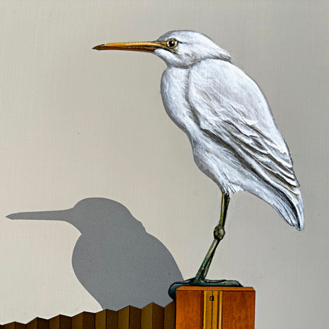 Detail of Photorealistic acrylic painting of a Small white heron sitting atop an old camera and two books, one titled "Bird Life 3", against a white background by James Carter - Cottage Curator - Sperryville VA Art Gallery