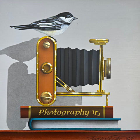 Photorealistic acrylic painting of a chickadee sitting atop an old camera and two books, one titled "Photography 5", against a white background by James Carter - Cottage Curator - Sperryville VA Art Gallery