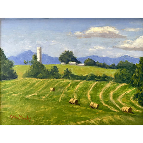 Landscape painting of a green field with haybales, a farm in the background and blue mountains in the distance against a blue sky by Kathy Chumley - Cottage Curator - Sperryville VA Art Gallery