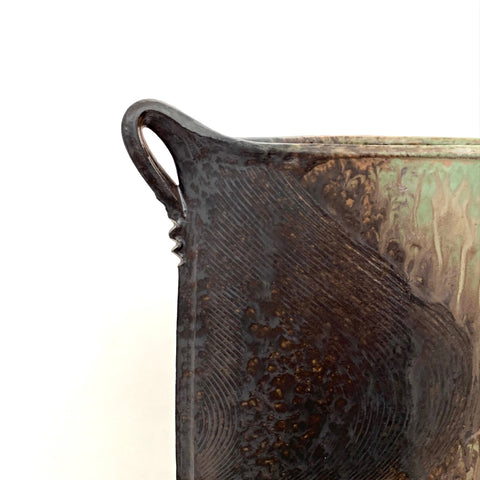 Detail view of oval stoneware vessel with two handles in washed glazes of pastel blue, green and neutral browns and tans by Richard Aerni at Cottage Curator - Sperryville VA Art Gallery
