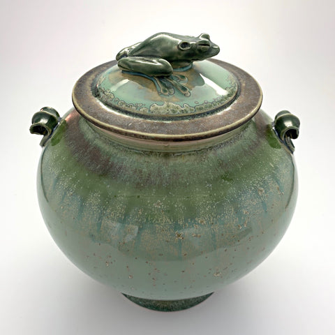 Green ceramic vessel with tree frog perched on top of lid by Richard Aerni at Cotttage Curator - Sperryville VA Art Gallery