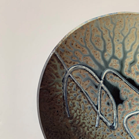 Detail of Stoneware wall platter with brown, blue, tan and gray glazing and raised spiral design by Richard Aerni at Cottage Curator - Sperryville VA Art Gallery