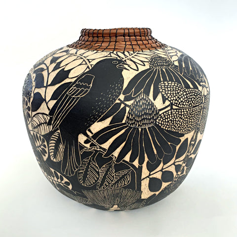 Black and white terra sigillata stoneware vessel with sgraffito carvings of blackbird, lotus and dragonfly with pine needles woven around neck of vase by Carolyn Blazeck at Cottage Curator - Sperryville VA Art Gallery