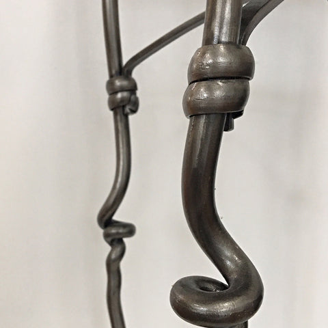 Detail of swirl wrapped legs on forged steel accent table with four legs and square top by Rob Caperell at Cottage Curator - Sperryville VA Art Gallery