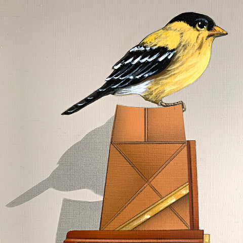 Detail of bird in "Bird Watching (Gold Finch)" - a painting of a goldfinch perched on top of an old-fashioned camera sitting on a book - by artist James Carter at Cottage Curator - Sperryville VA Art Gallery
