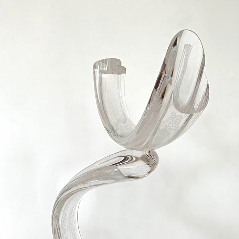 Detail of Clear blown-glass sculpture featuring three curves balanced on a square base by Neil Duman at Cottage Curator - Sperryville VA Art Gallery
