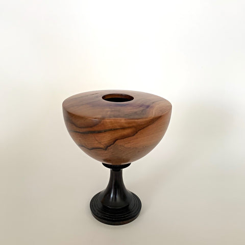 Turned wood vessel with round grained wood body and black pedestal base by L. Michael Fraser at Cottage Curator - Sperryville VA Art Gallery
