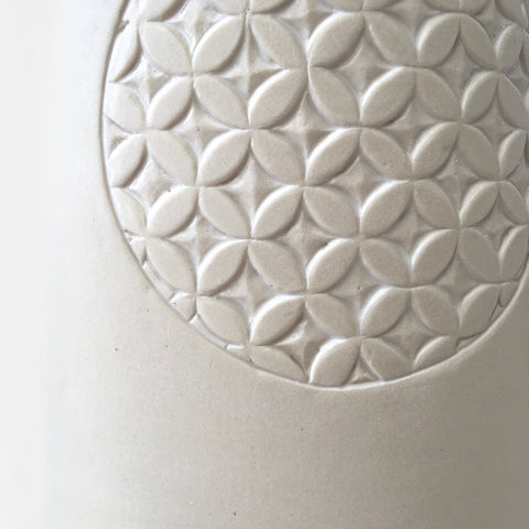 Detail of white porcelain vessel with carved patterned circle by Yoshi Fujii at Cottage Curator - Sperryville VA Art Gallery