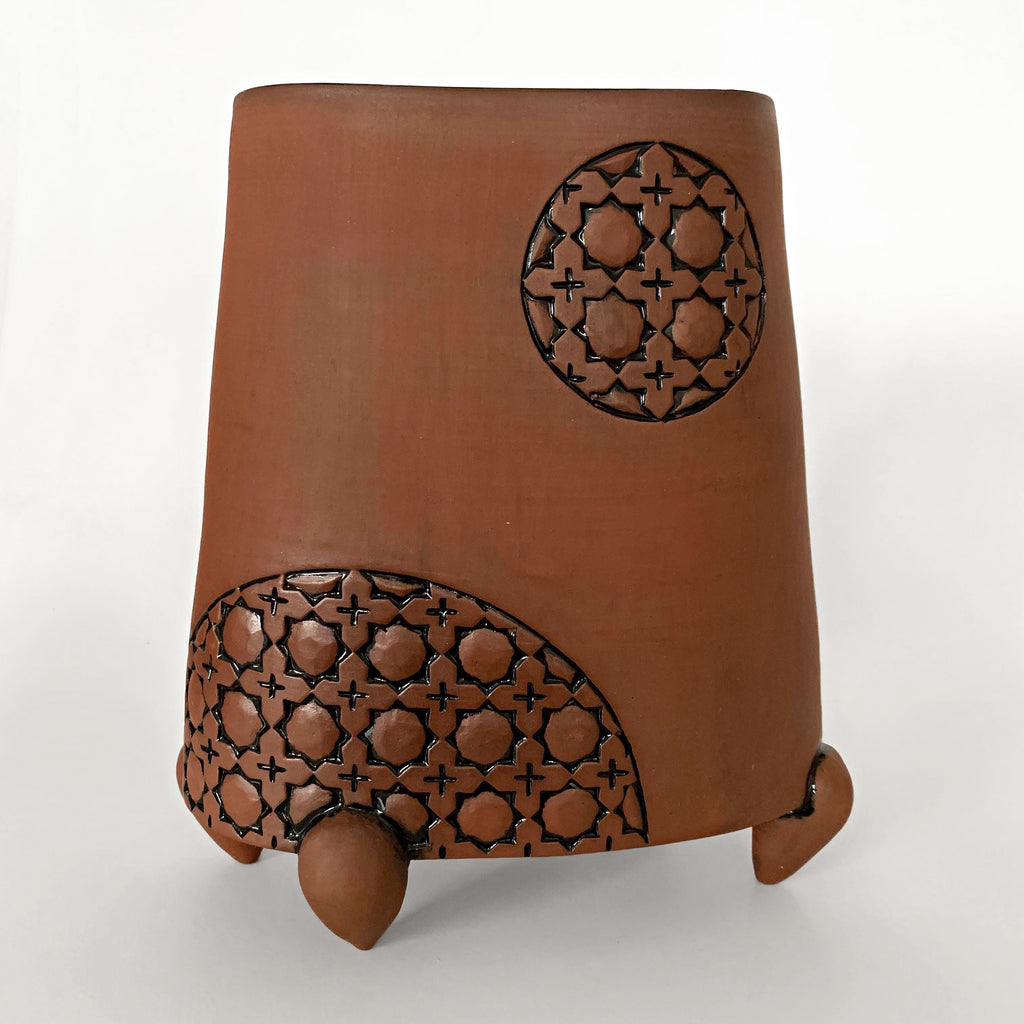 Stoneware vessel in natural tan clay color with carved patterned circles and three feet by Yoshi Fujii at Cottage Curator - Sperryville VA Art Gallery