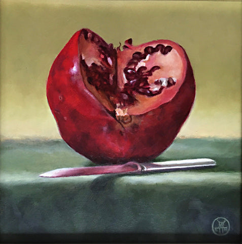 Painting of a pomegranate cut with a knife on a green table cloth by Davette Leonard at Cottage Curator art gallery Sperryville VA