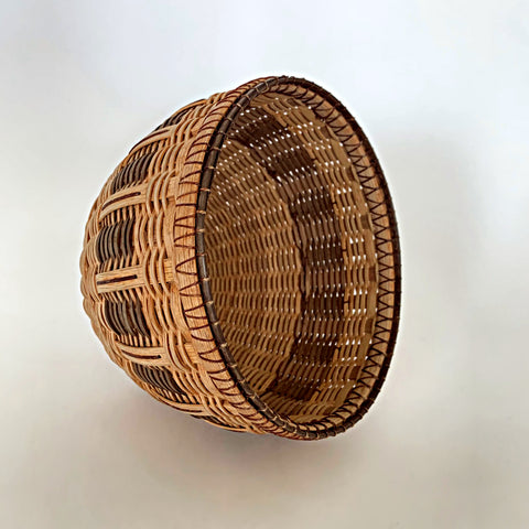 Round woven basket made of white oak in natural and brown patter by Leon Niehues at Cottage Curator - Sperryville VA Art Gallery