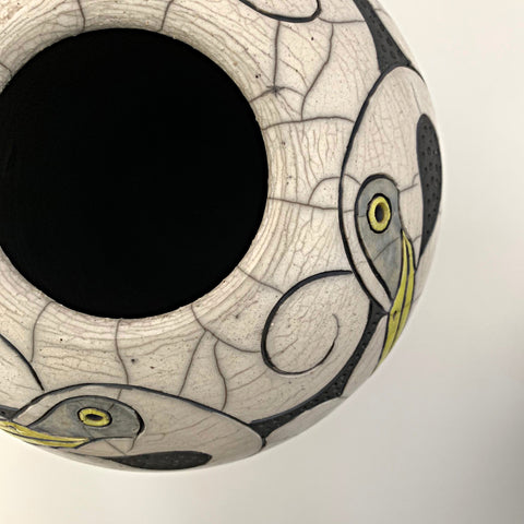 Detail of Wheel Thrown, carved, raku clay vessel in black, white and yellow with four egrets by Robin Rodgers at Cottage Curator - Sperryville VA Art Gallery
