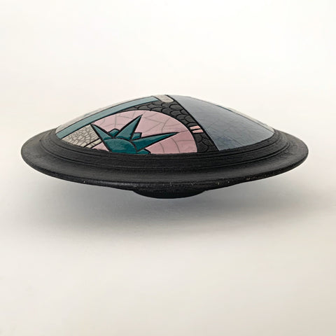 Side view of raku-fired round cache container with geometric patterns in green, blue and pink with black and white by Andy Smith at Cottage Curator - Sperryville VA Art Gallery