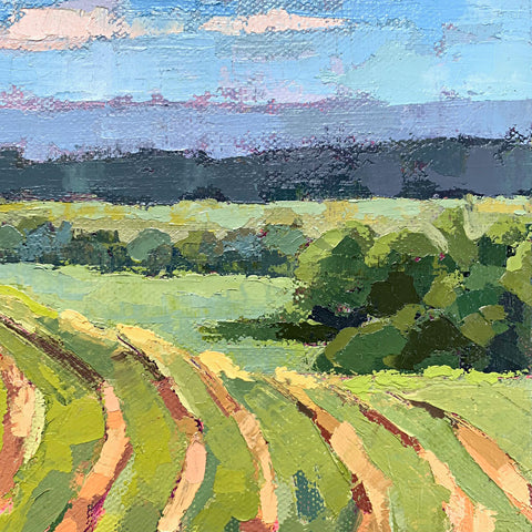 Detail of landscape painting with green fields under a blue sky with clouds by Joan Wiberg at Cottage Curator - Sperryville VA